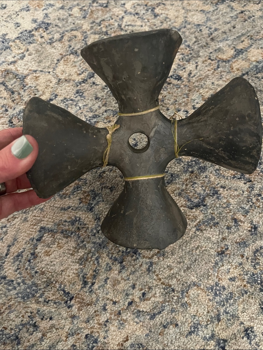Antique dark gray metal quatrefoil sculpture